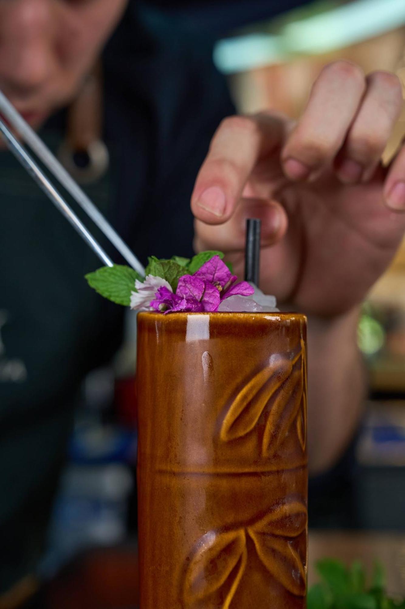 Pullman Santiago Vitacura Экстерьер фото A tiki drink being garnished